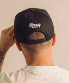Stray Sun Rise Hat - Black detail — dog lover hat that funds shelter meals · Stray Project
