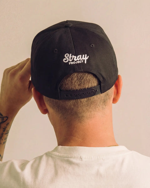 Stray Sun Rise Hat - Black detail — dog lover hat that funds shelter meals · Stray Project