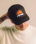 Stray Sun Rise Hat - Black detail — dog lover hat that funds shelter meals · Stray Project