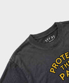 Person wearing Protect The Pack rescue dog tee — Stray Project apparel that funds shelter meals through every purchase