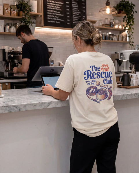 The Rescue Club Tee detail — rescue dog tee that funds shelter meals · Stray Project