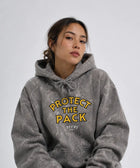 Back view of the Protect The Pack limited camo hoodie on a model outdoors