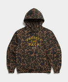Protect The Pack Hoodie in Duck Camo — shelter dog hoodie from Stray Project. Every purchase funds shelter dog meals.