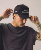 Stray Department Hat detail — dog lover hat that funds shelter meals · Stray Project