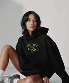Protect The Pack Hoodie detail — shelter dog hoodie that funds shelter meals · Stray Project