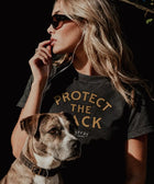 Stray Project Protect The Pack tee lifestyle shot — supporting rescue dogs and shelter adoption with every cotton tee sold